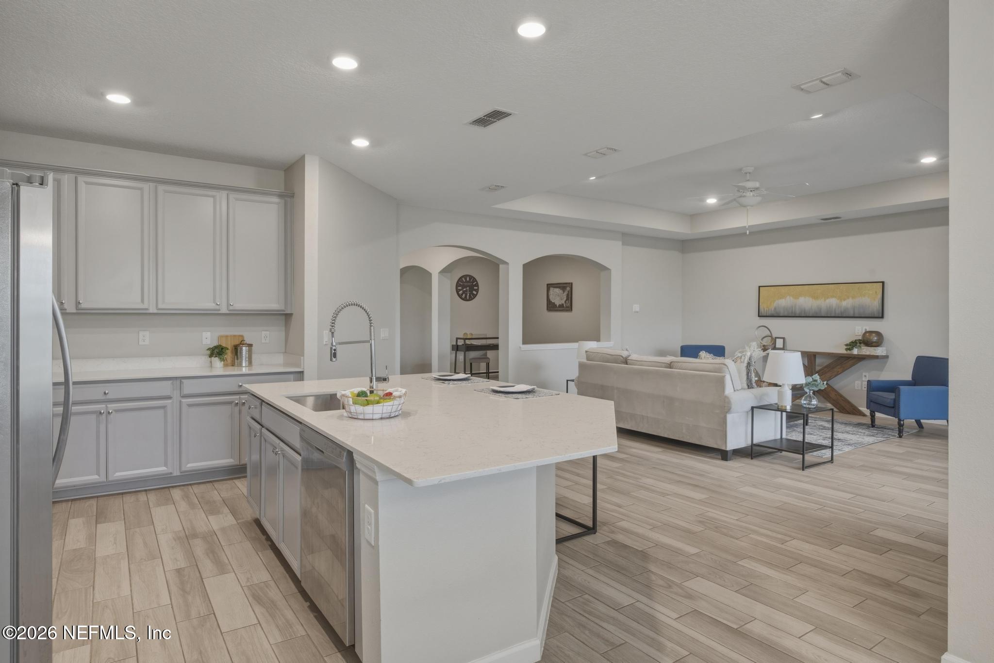 3841 Heatherbrook Place Middleburg, FL 32068 - Photo 13 of 39 a large white kitchen with sink and cabinets