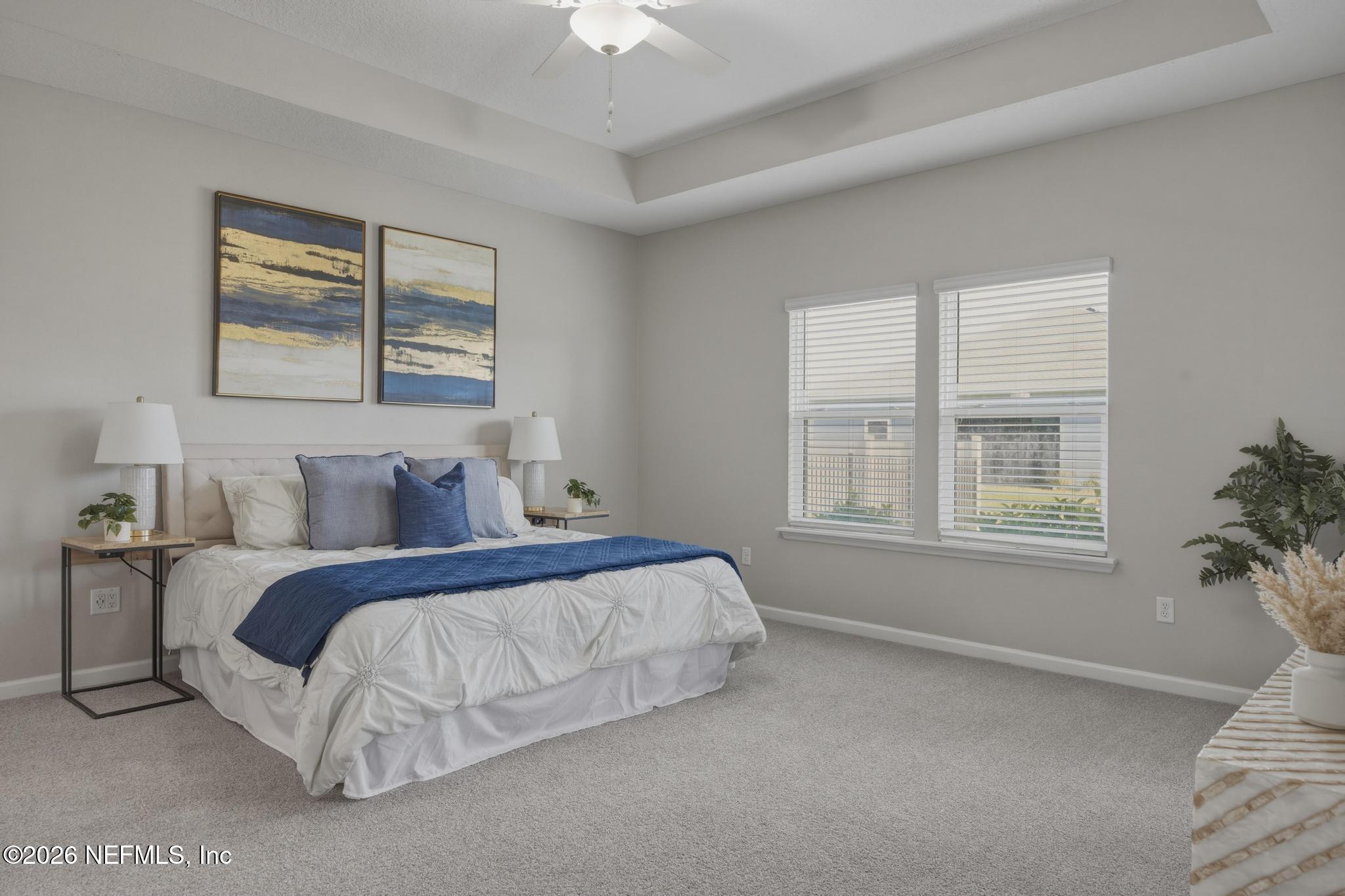 3841 Heatherbrook Place Middleburg, FL 32068 - Photo 17 of 39 a bed sitting in a bedroom next to a window