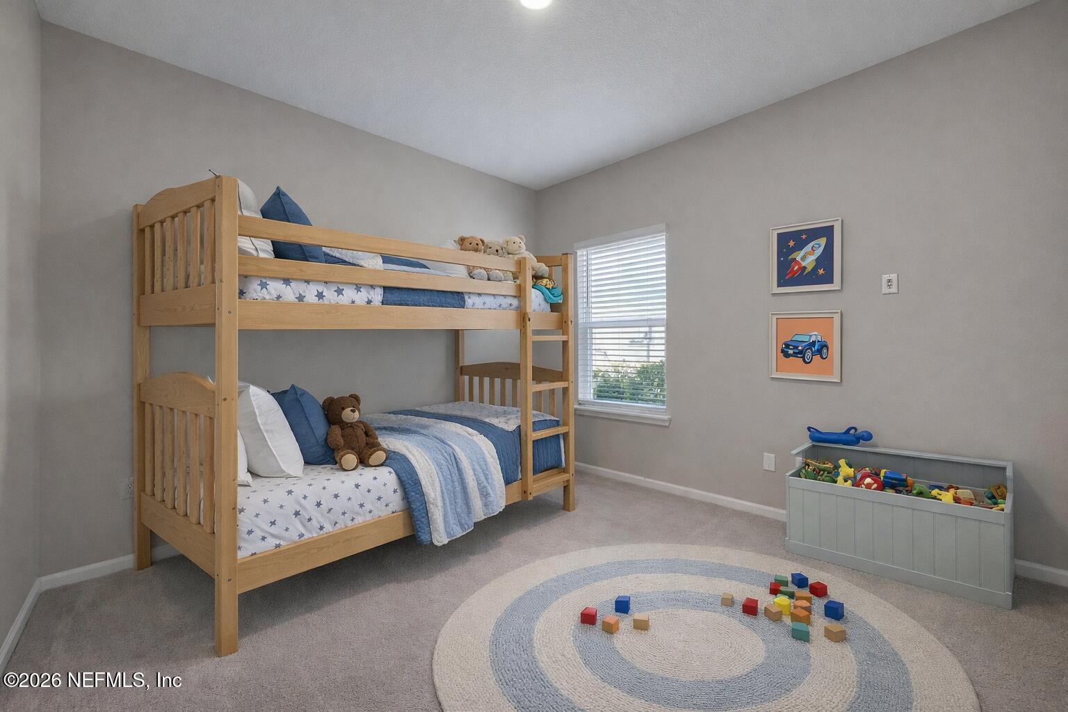 3841 Heatherbrook Place Middleburg, FL 32068 - Photo 25 of 39 a bedroom with a bed and a chandelier