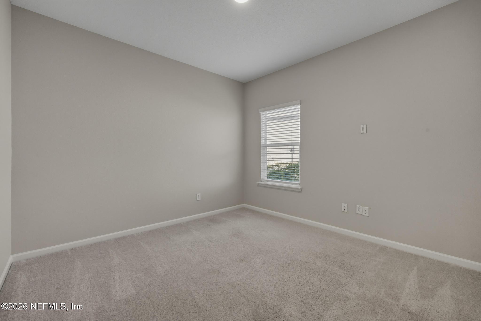 3841 Heatherbrook Place Middleburg, FL 32068 - Photo 26 of 39 an empty room with windows