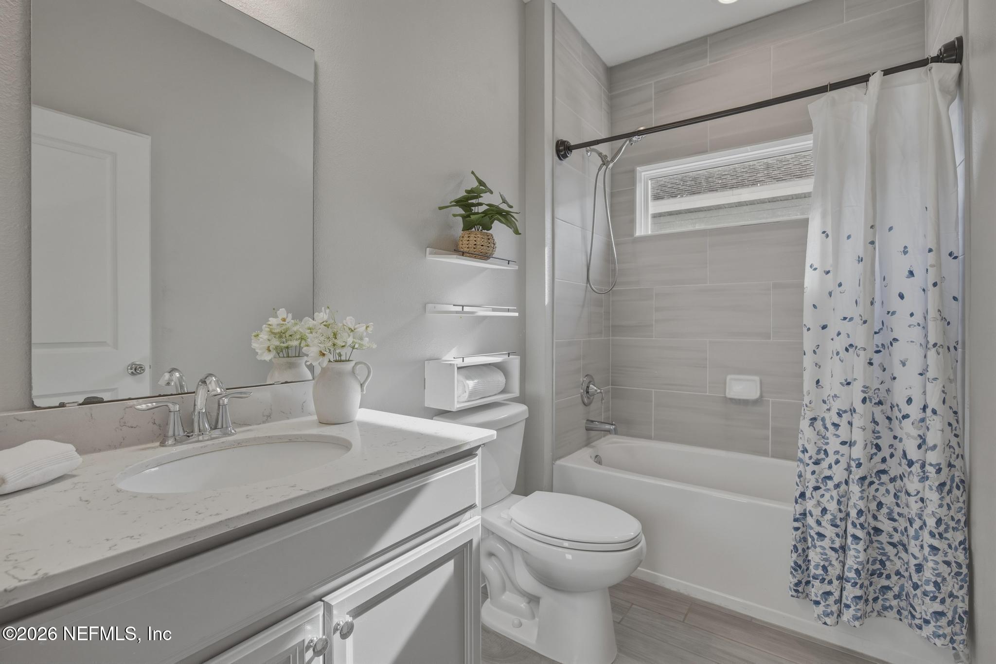 3841 Heatherbrook Place Middleburg, FL 32068 - Photo 27 of 39 a bathroom with a granite countertop sink toilet and shower