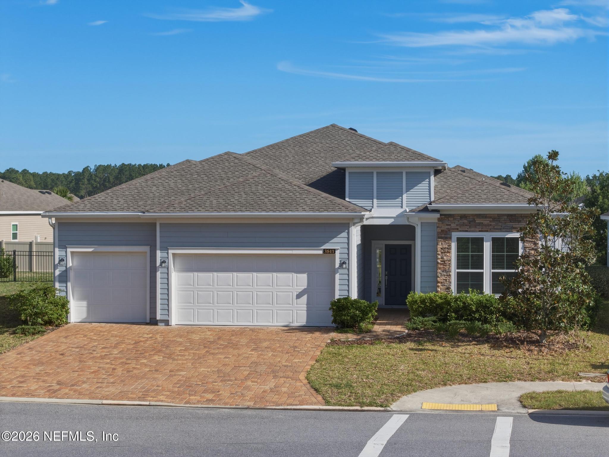 3841 Heatherbrook Place Middleburg, FL 32068 - Photo 2 of 39 a front view of a house with yard