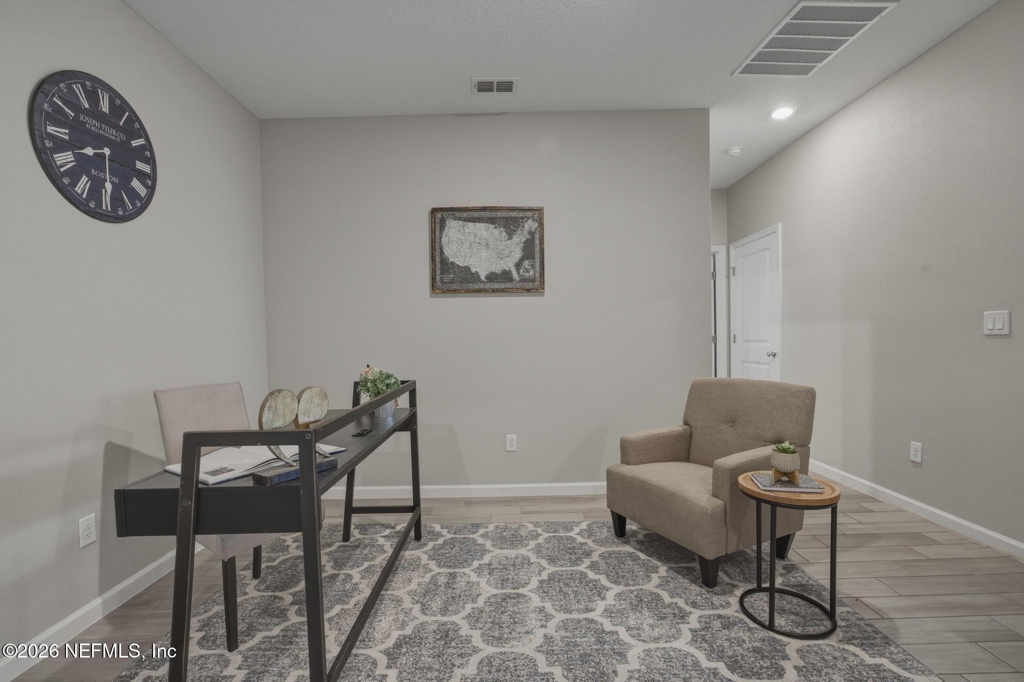 3841 Heatherbrook Place Middleburg, FL 32068 - Photo 5 of 39 a living room with furniture and a window