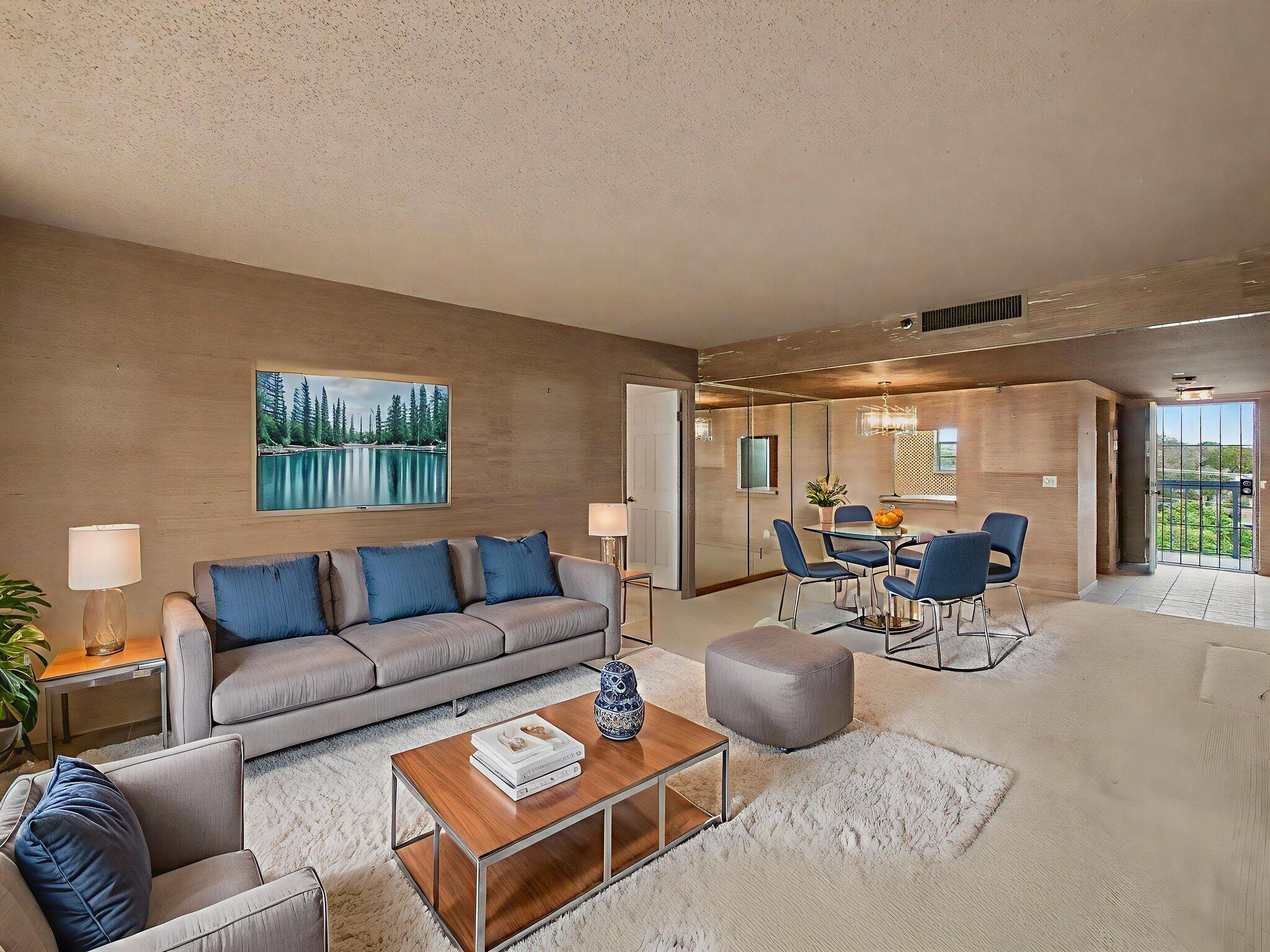 198 Northwest 67th Street, Unit 505 Boca Raton, FL 33487 - Photo 6 of 15 a living room with furniture and a large window