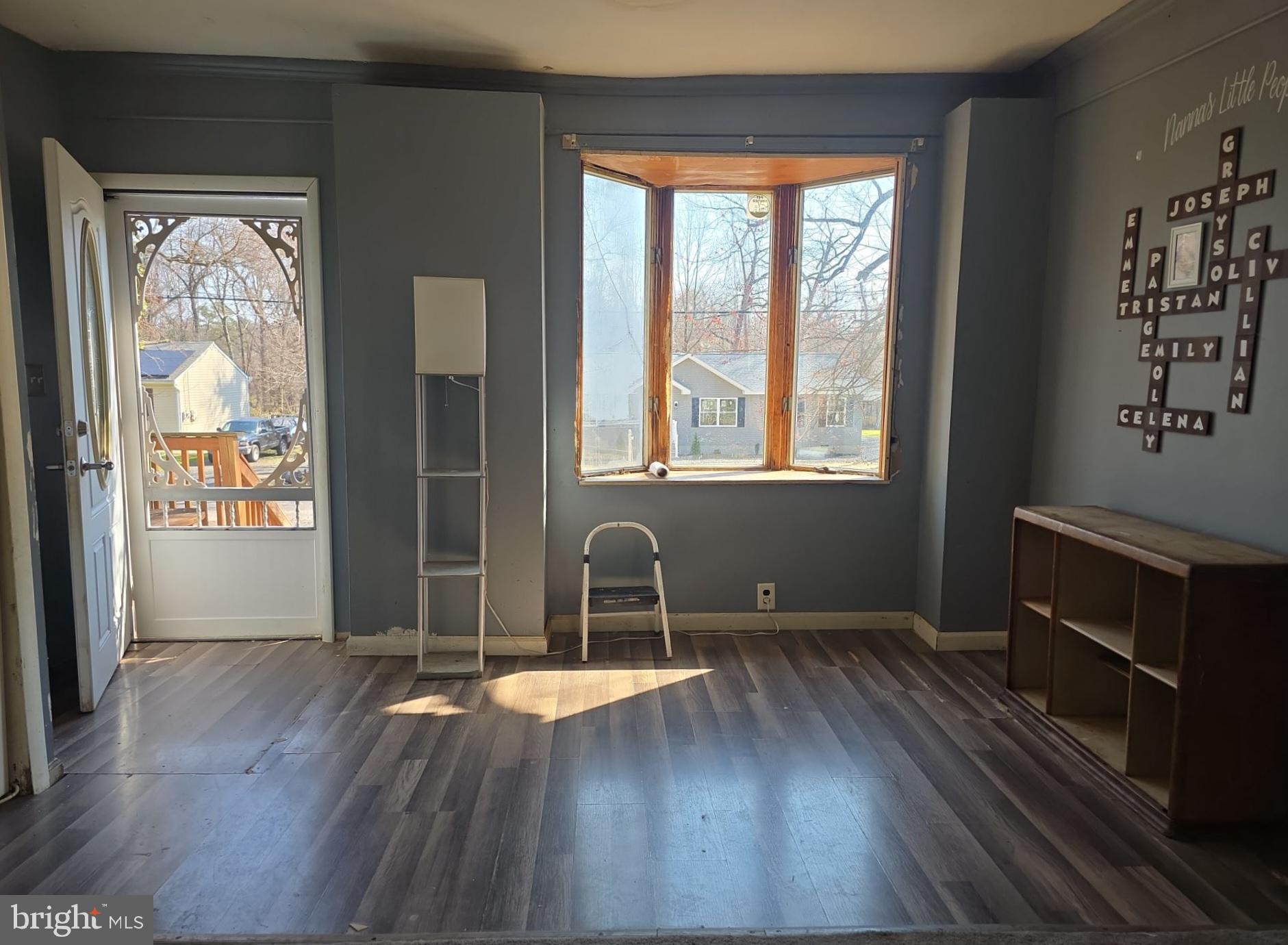 44 Highland Avenue Clementon, NJ 08021 - Photo 13 of 37 an empty room with wooden floor and windows