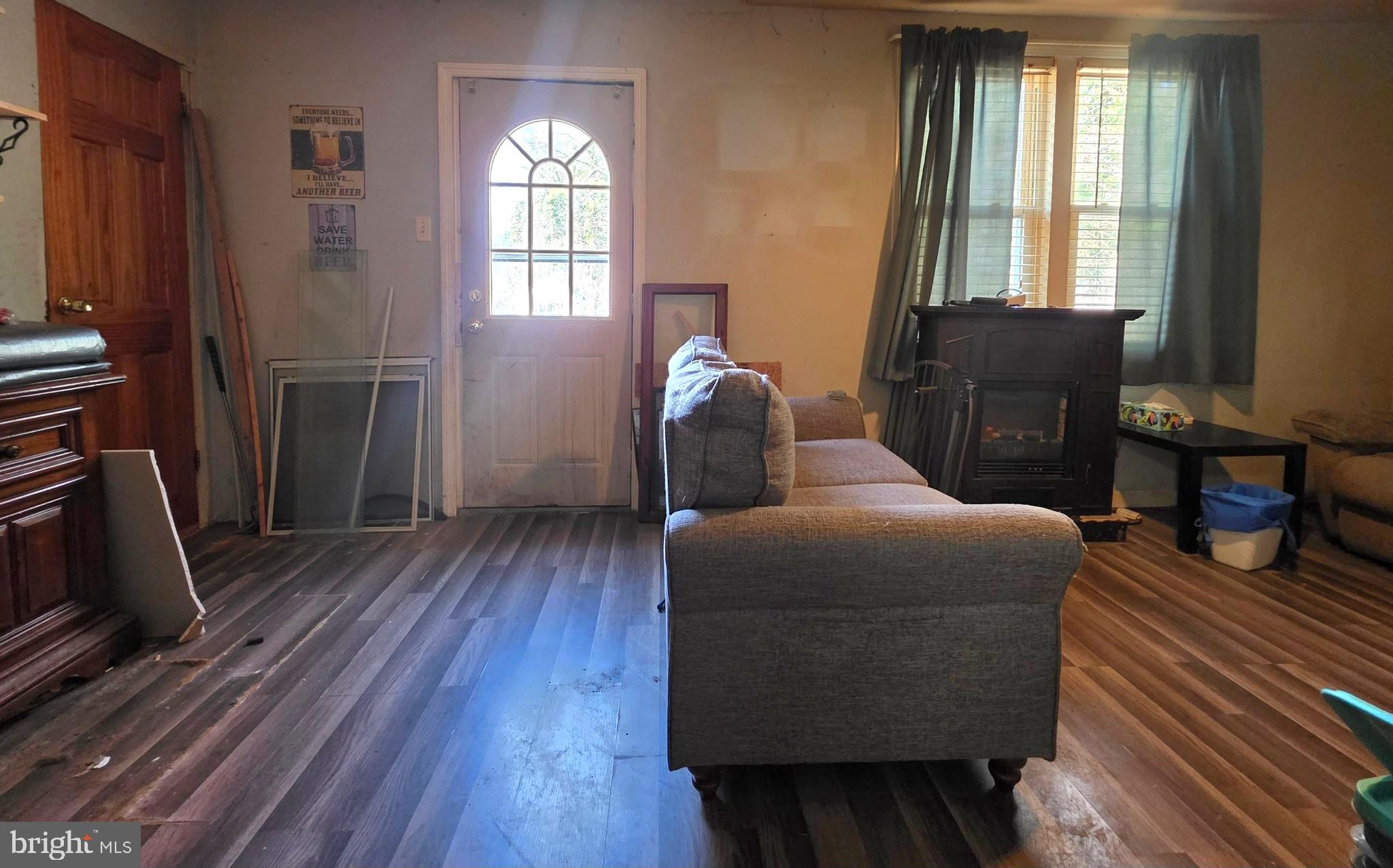 44 Highland Avenue Clementon, NJ 08021 - Photo 24 of 37 a living room with furniture and a fireplace