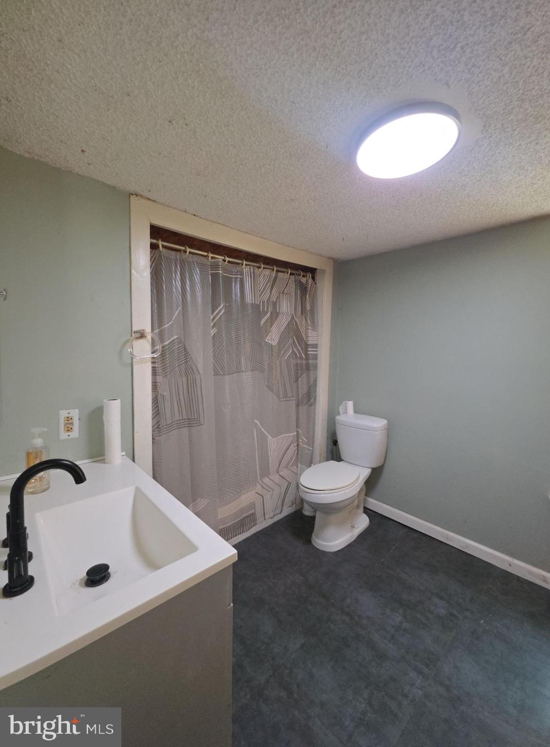 44 Highland Avenue Clementon, NJ 08021 - Photo 32 of 37 a bathroom with a sink and a toilet