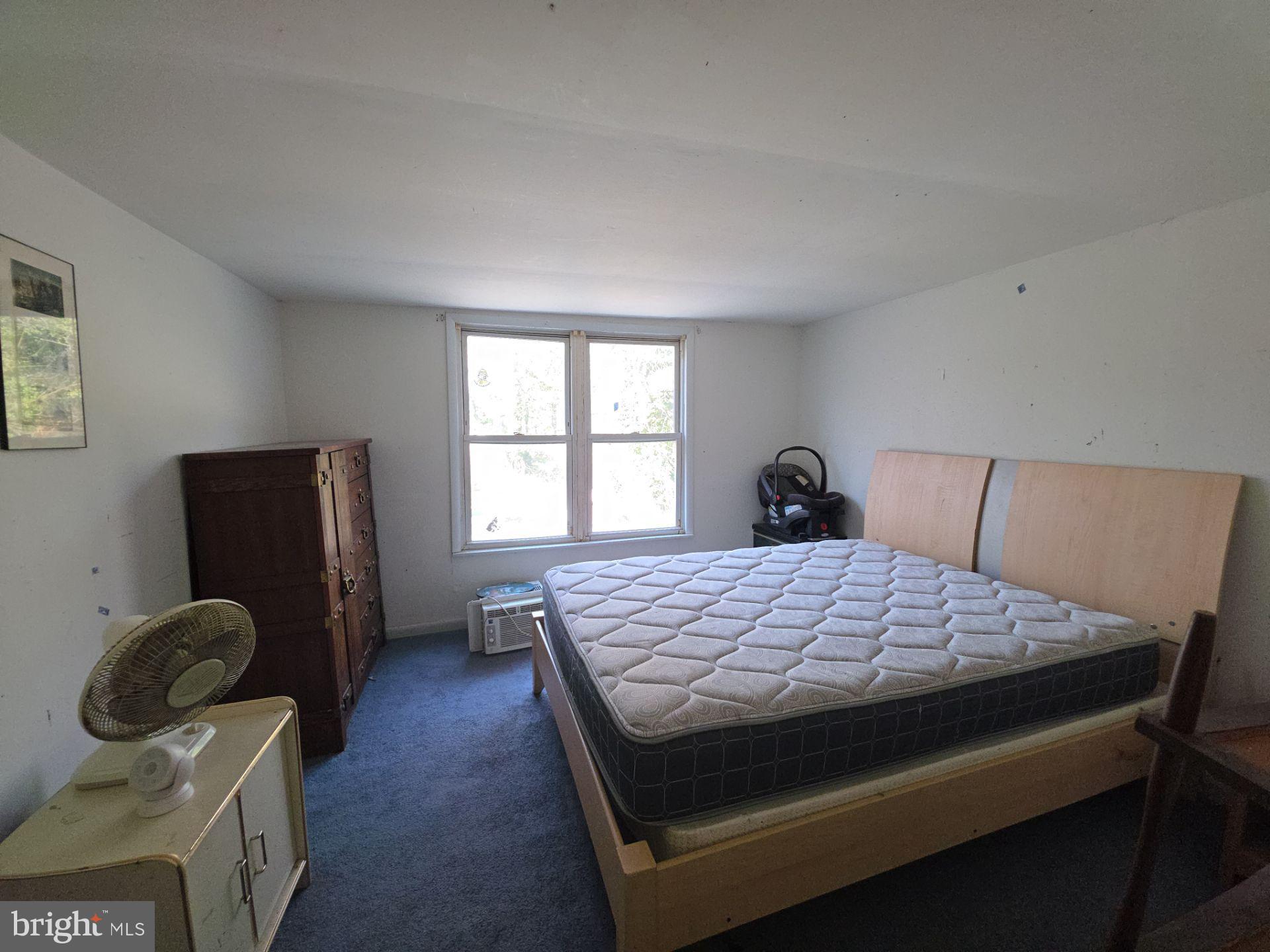44 Highland Avenue Clementon, NJ 08021 - Photo 34 of 37 a bedroom with a bed and window with window