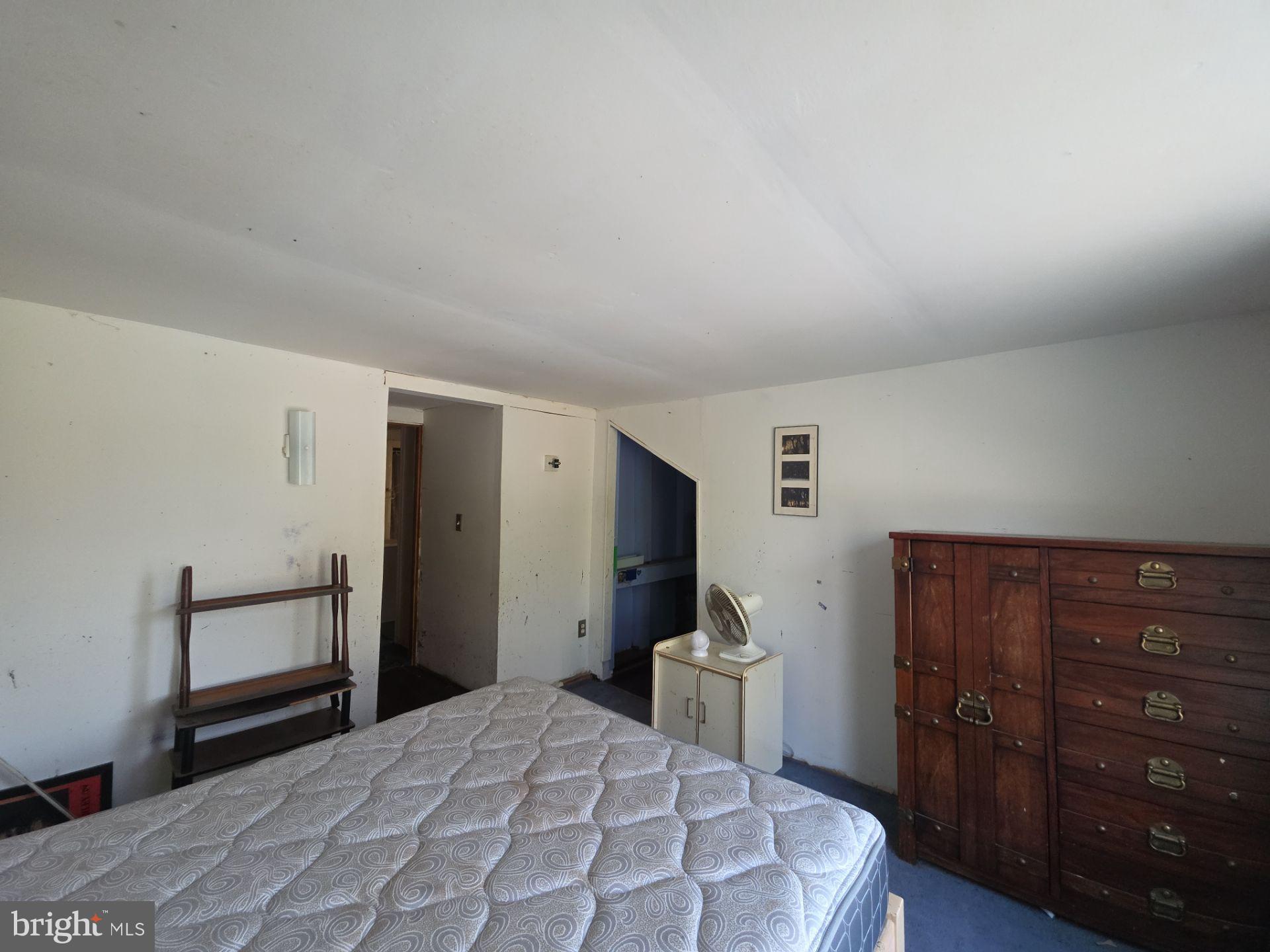 44 Highland Avenue Clementon, NJ 08021 - Photo 35 of 37 a bedroom with a bed and a dresser