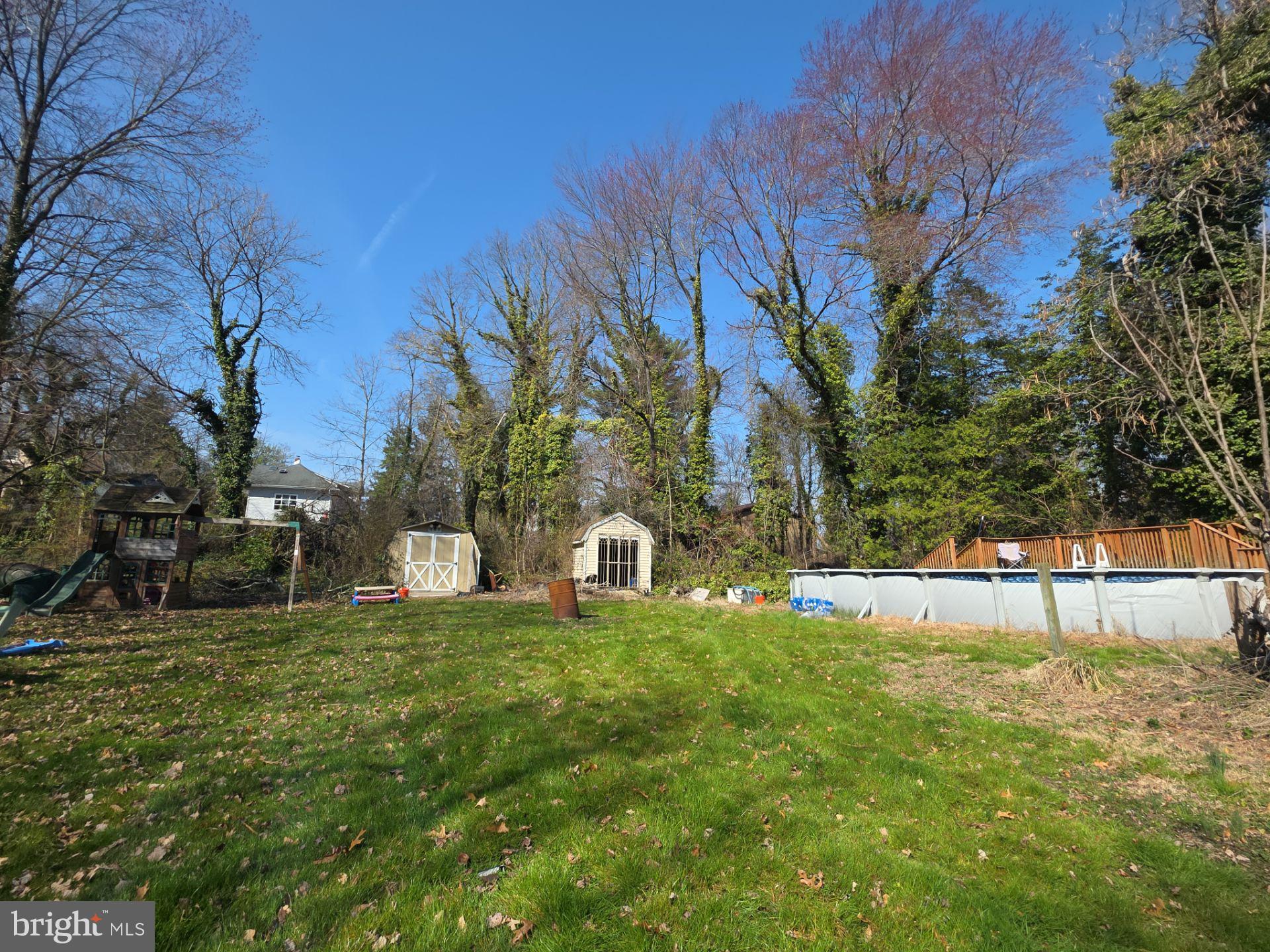 44 Highland Avenue Clementon, NJ 08021 - Photo 5 of 37 a view of a backyard with large trees