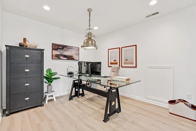 a bedroom with furniture and a book shelf