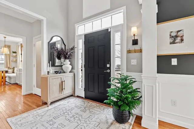 a living room with furniture and potted plant