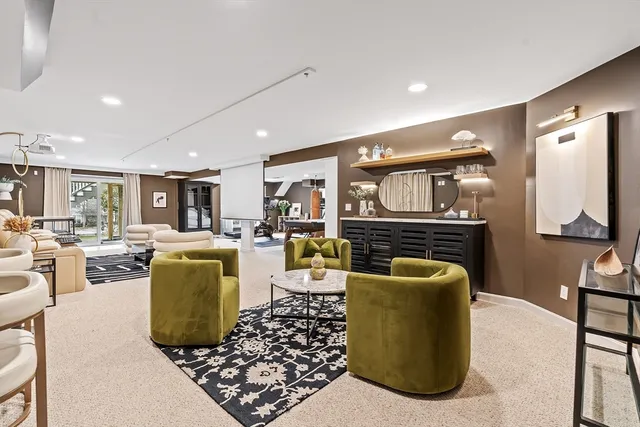 a front view of house with yard and trees around