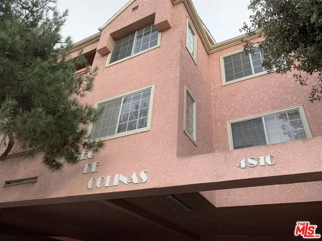 a view of a house with a street