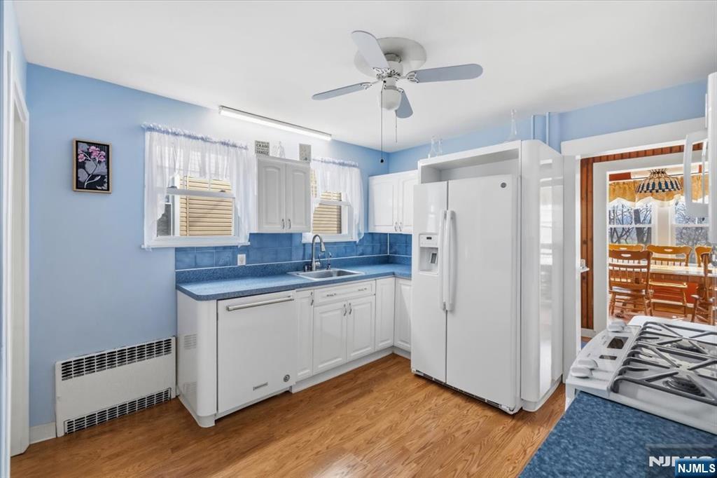 119 Overpeck Avenue Ridgefield Park, NJ 07660 - Photo 11 of 44 a kitchen with stainless steel appliances granite countertop a refrigerator and a stove