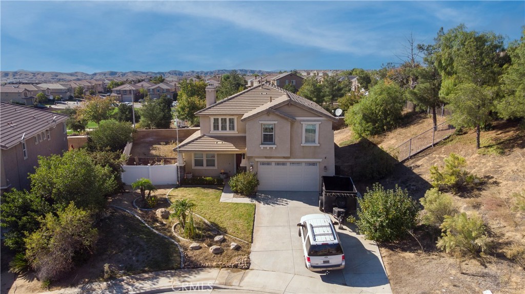 an aerial view of a house with a garden