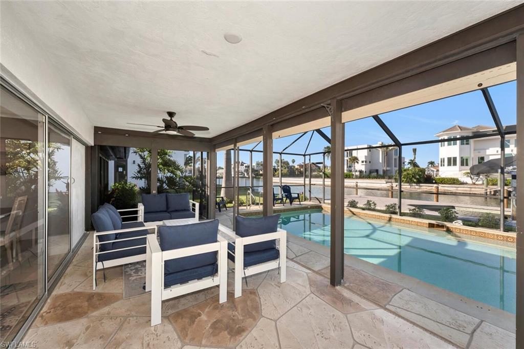 385 Willet Avenue Naples, FL 34108 - Photo 16 of 19 a room with lots of table and chairs