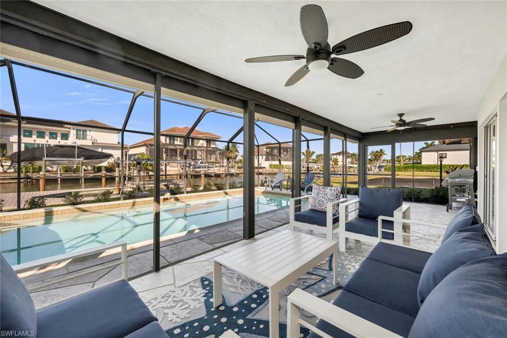 385 Willet Avenue Naples, FL 34108 - Photo 17 of 19 a living room with furniture and a large window