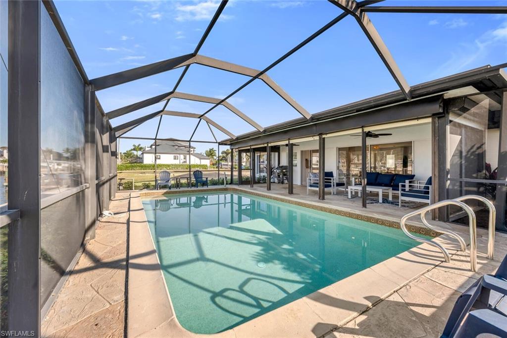 385 Willet Avenue Naples, FL 34108 - Photo 19 of 19 a view of a swimming pool with a patio