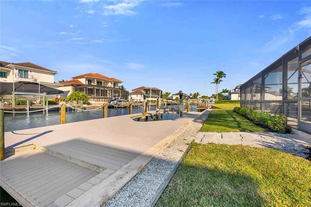 385 Willet Avenue Naples, FL 34108 - Photo 4 of 19 a view of a house with swimming pool