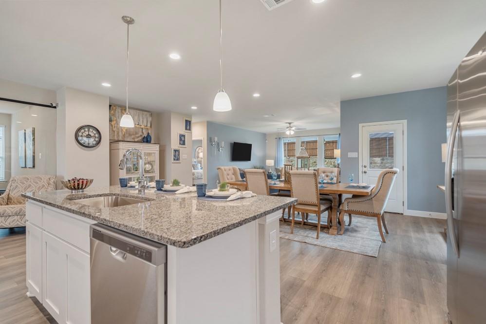 118 Stanton Avenue Rhome, TX 76078 - Photo 3 of 30 a kitchen with center island table and chairs