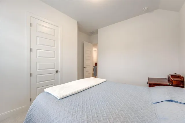 a bedroom with a bed and a closet