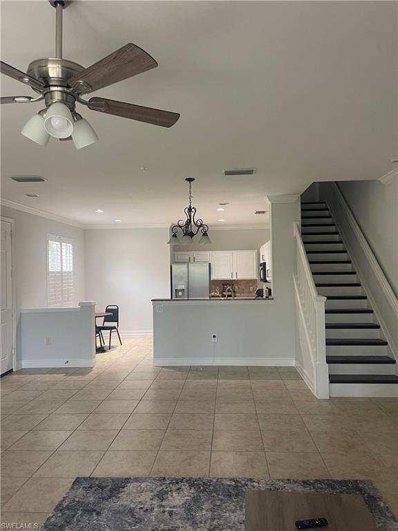 884 Hampton Circle, Unit 159 Naples, FL 34105 - Photo 9 of 28 a view of a kitchen with a sink cabinets and window