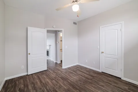 an empty room with wooden floor