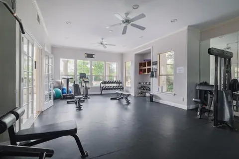 a view of a livingroom with workspace and a window