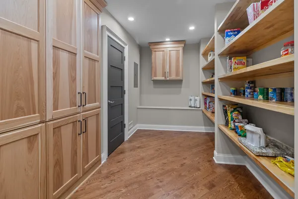 a view of storage and utility room with racks on the wall