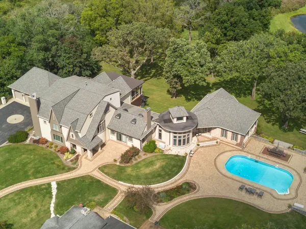 an aerial view of a house with outdoor space