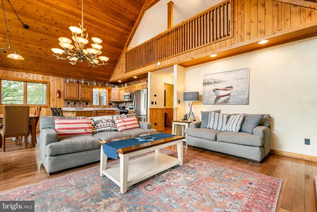 a living room with furniture and a rug