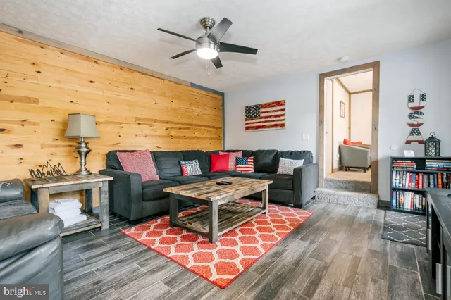 a bathroom with a toilet a sink and a mirror
