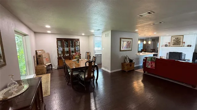 a living room with furniture window and wooden floor