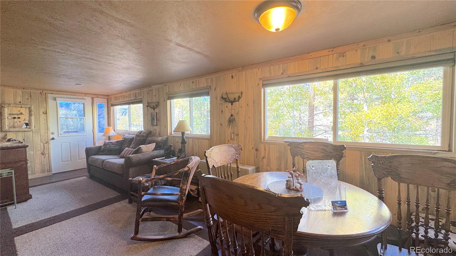 582 Pactolus Lake Road Black Hawk, CO 80422 - Photo 4 of 11 a living room with furniture and a large window