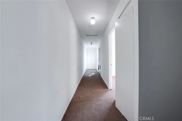 a view of hallway with a couch