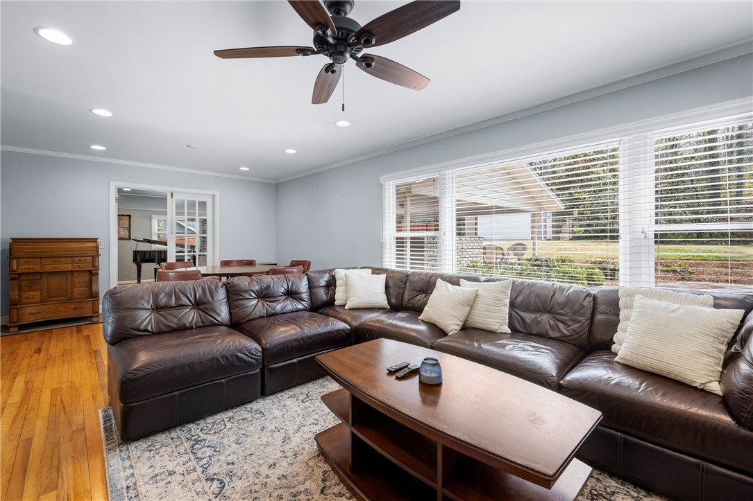 210 Riggs Drive Clemson, SC 29631 - Photo 11 of 36 This inviting living space features gleaming hardwood floors and ample natural light through expansive windows.