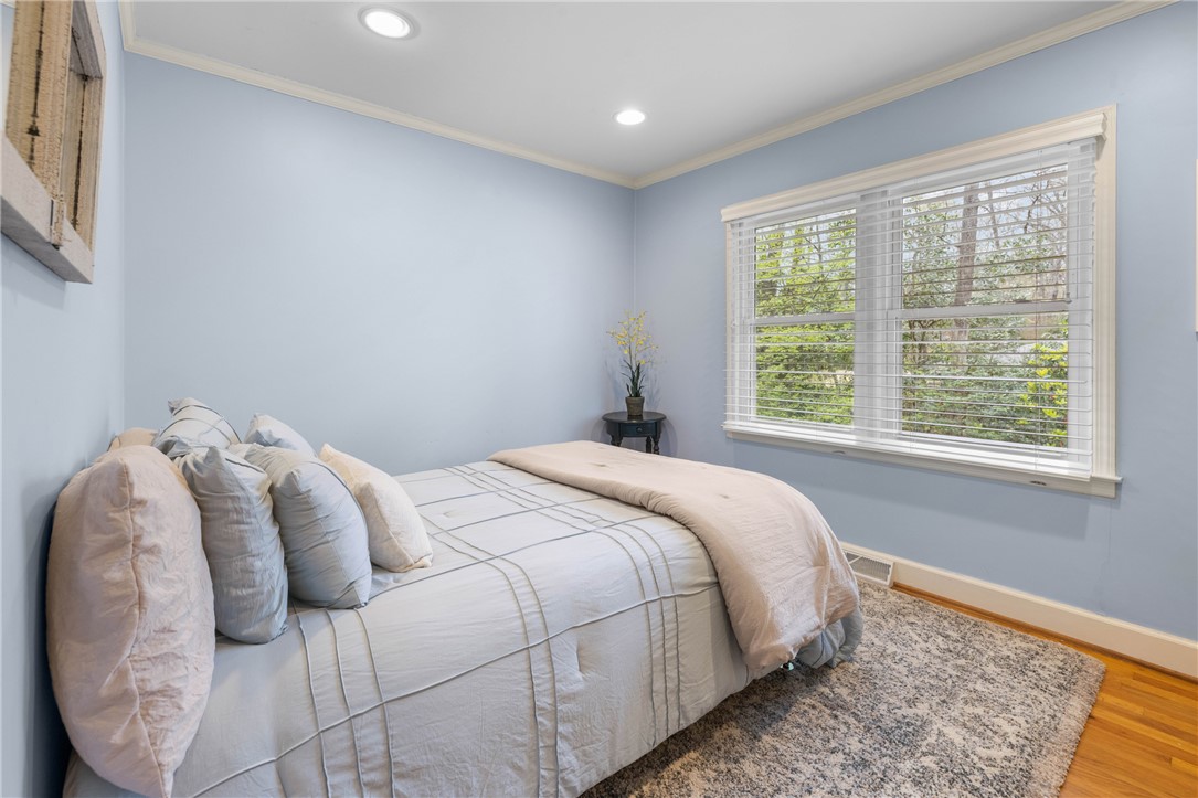 210 Riggs Drive Clemson, SC 29631 - Photo 15 of 36 This cozy room offers a tranquil escape, featuring warm hardwood floors and abundant natural light.