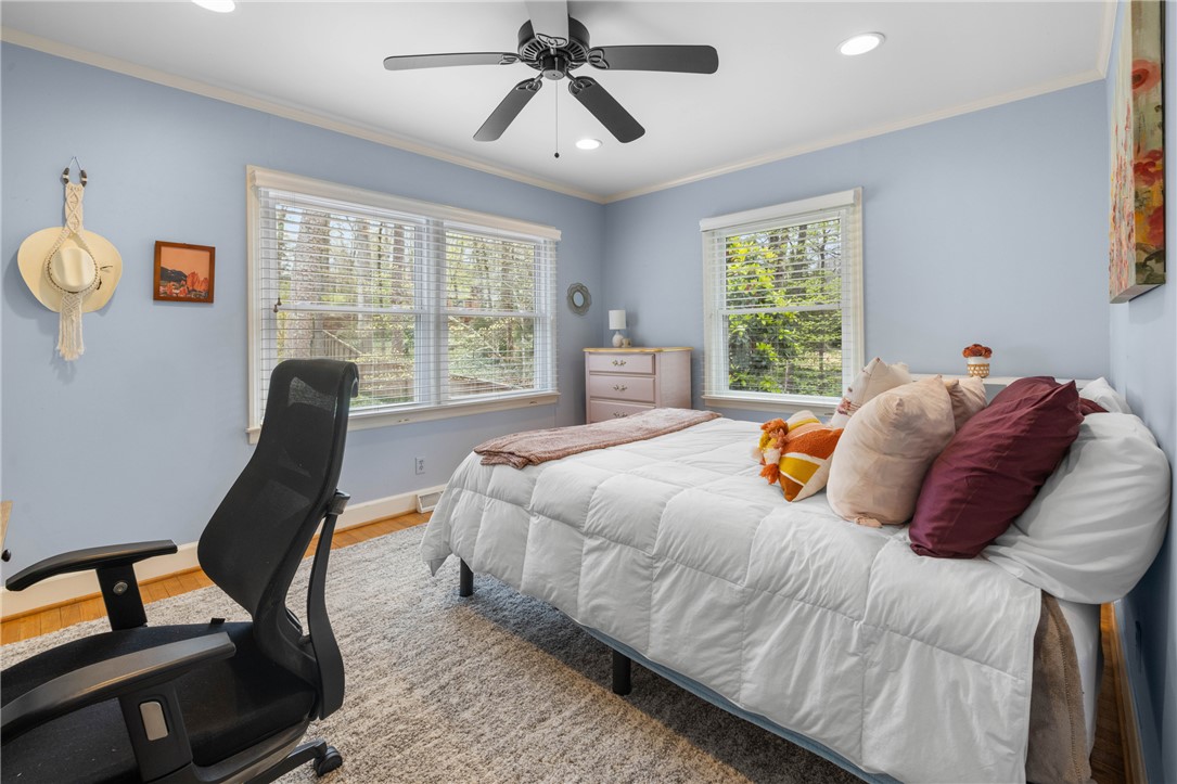 210 Riggs Drive Clemson, SC 29631 - Photo 16 of 36 This cozy bedroom features ample natural light and comfortable carpeting, creating a serene personal retreat.