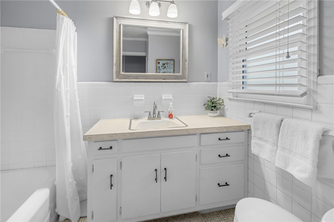210 Riggs Drive Clemson, SC 29631 - Photo 17 of 36 This bright bathroom features a vanity with ample storage and classic tiled walls.