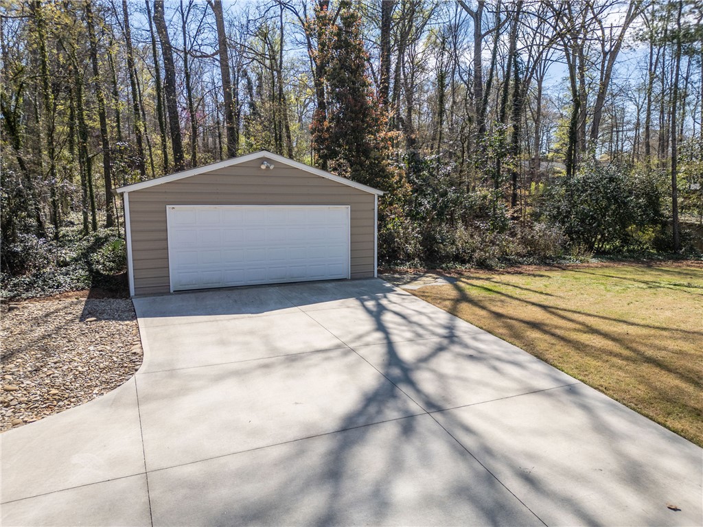 210 Riggs Drive Clemson, SC 29631 - Photo 25 of 36 This private garage offers secure parking and additional storage amidst a natural setting.