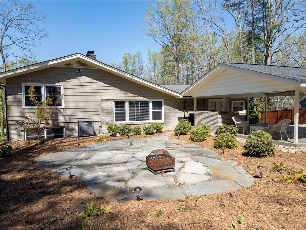 210 Riggs Drive Clemson, SC 29631 - Photo 27 of 36 This residence features a comfortable patio with a fire pit, ideal for outdoor gatherings.