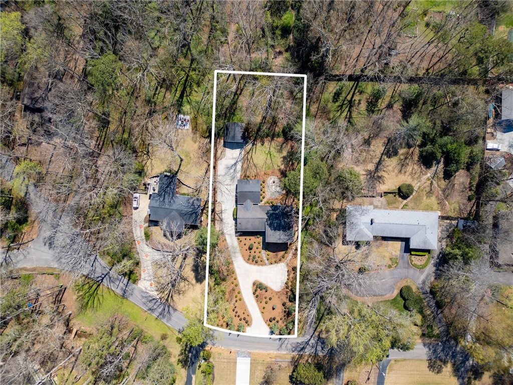 210 Riggs Drive Clemson, SC 29631 - Photo 30 of 36 This overhead perspective showcases a sprawling property with a private driveway, surrounded by mature trees.