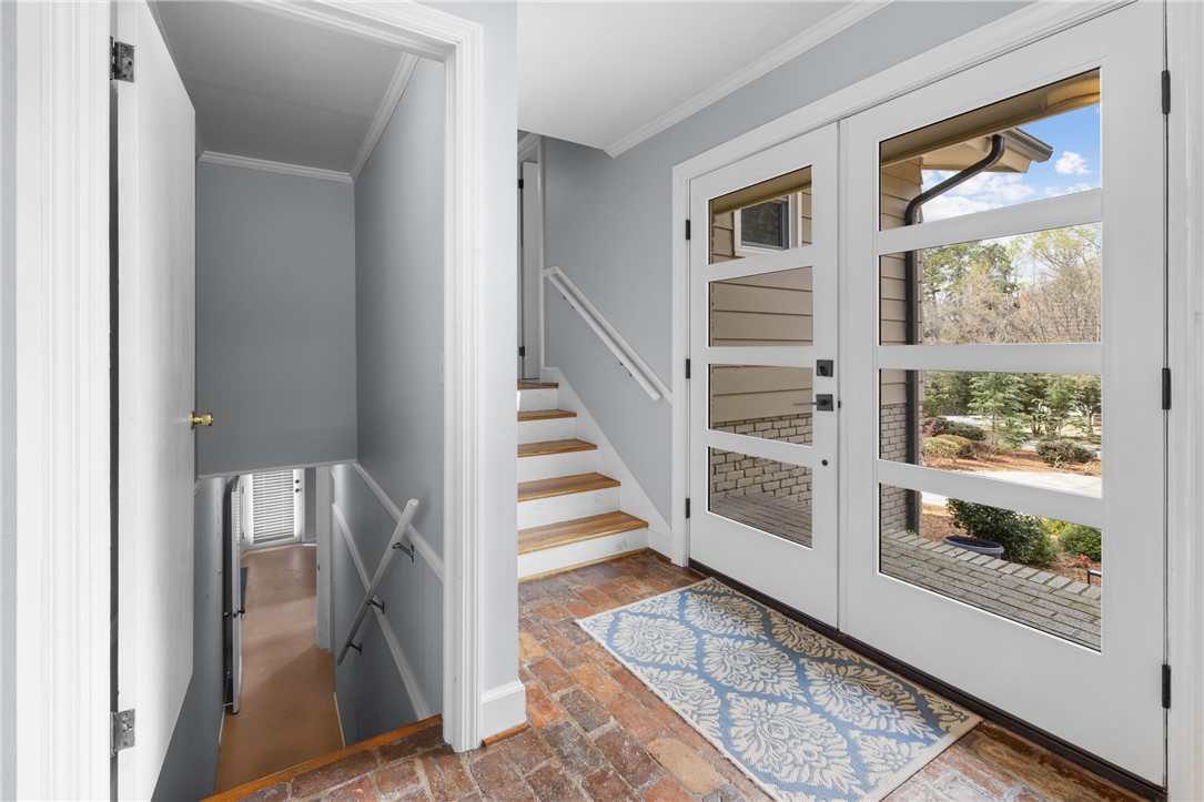 210 Riggs Drive Clemson, SC 29631 - Photo 3 of 36 This inviting entryway showcases a blend of rustic and modern design elements.