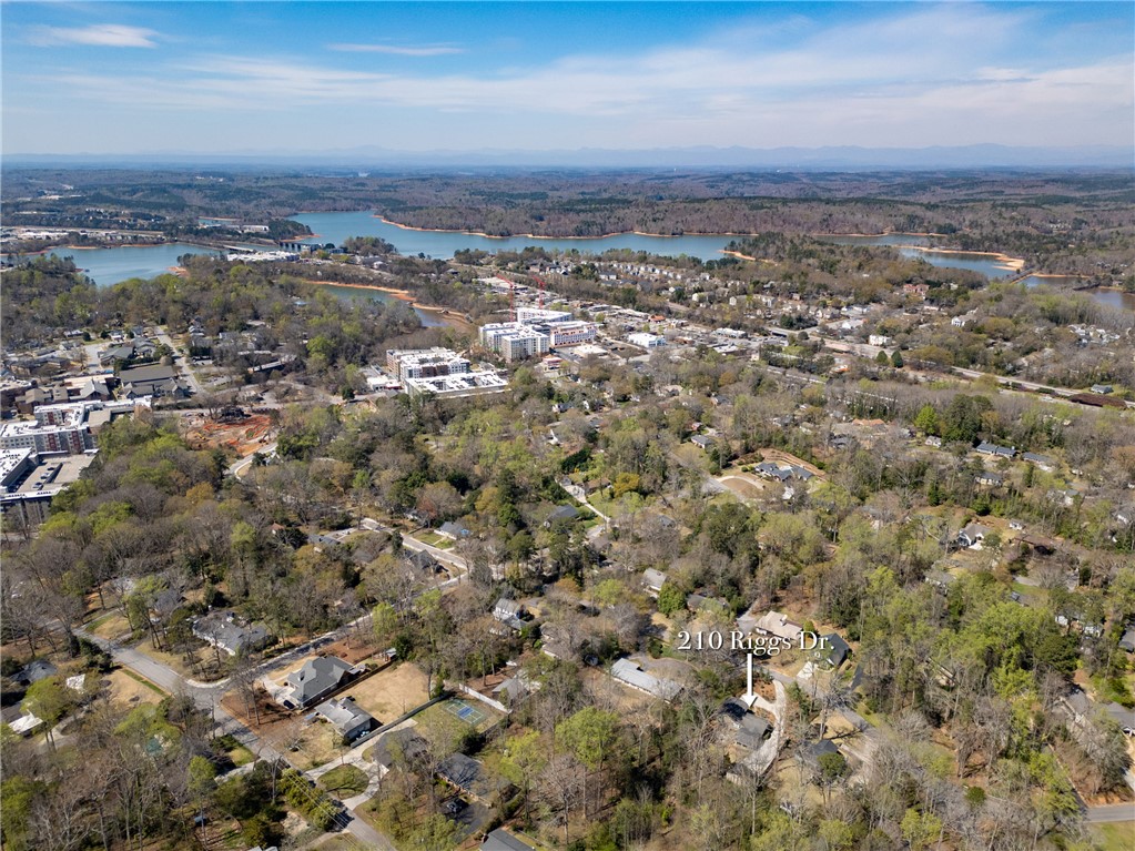 210 Riggs Drive Clemson, SC 29631 - Photo 35 of 36 This panoramic view showcases a serene lake and a vibrant community surrounded by lush trees.
