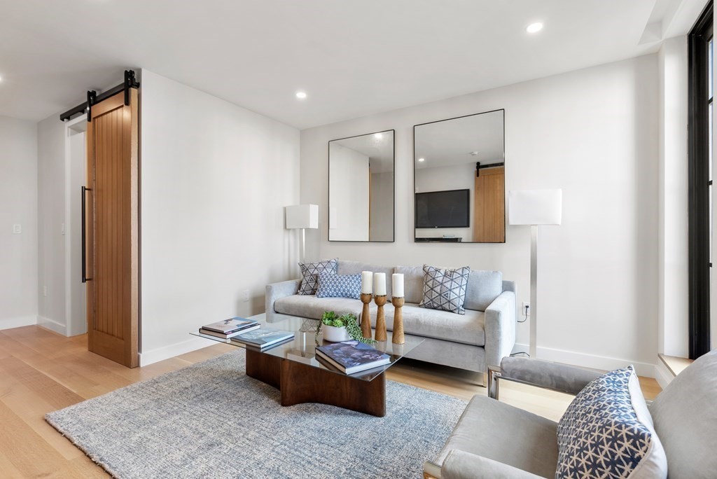 76 Wareham Street, Unit 4A Boston, MA 02118 - Photo 11 of 38 a living room with furniture and a rug