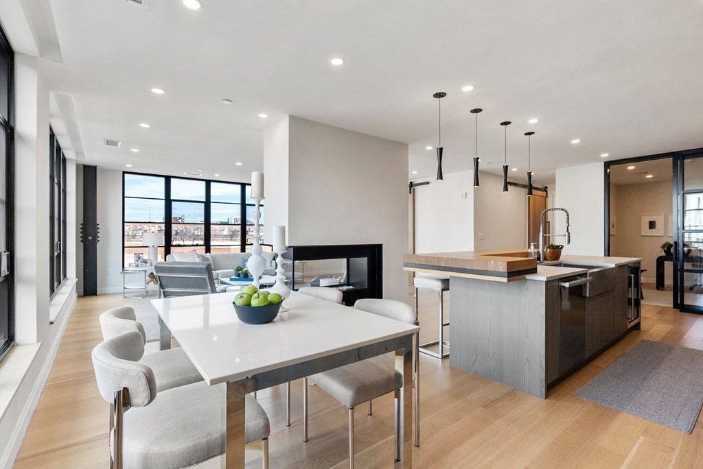 76 Wareham Street, Unit 4A Boston, MA 02118 - Photo 2 of 38 a kitchen with a sink appliances and chairs