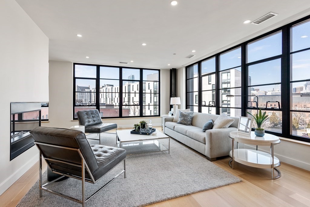 76 Wareham Street, Unit 4A Boston, MA 02118 - Photo 3 of 38 a living room with furniture and a large window