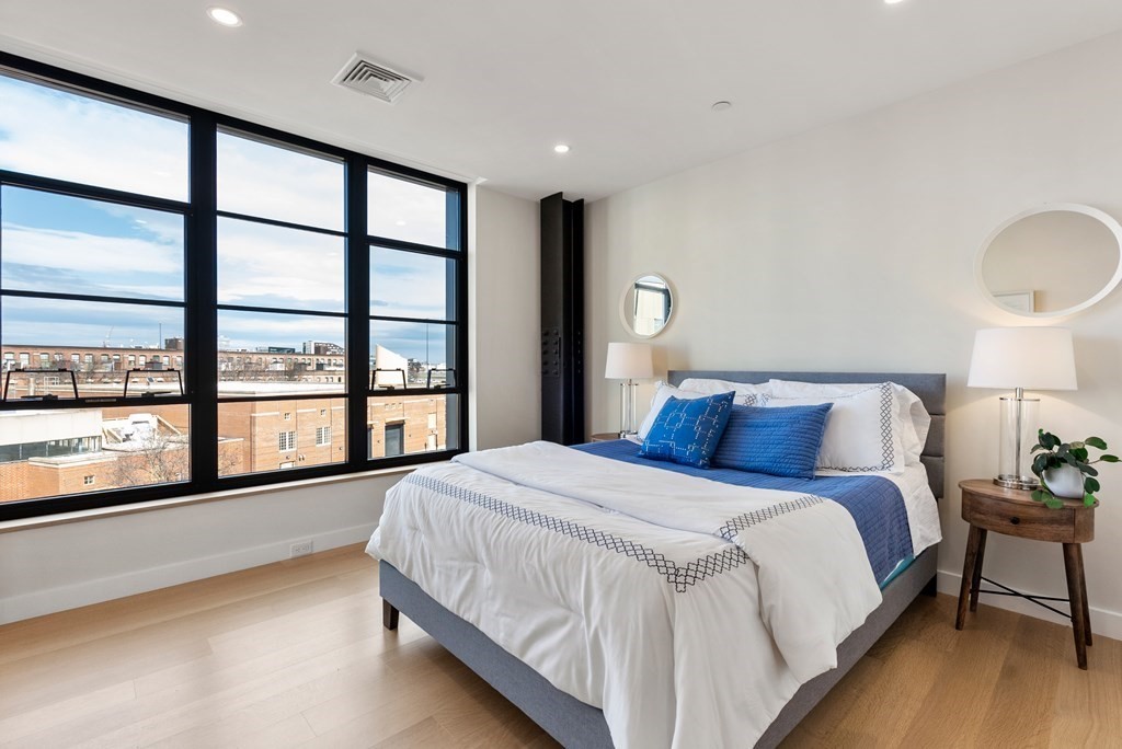 76 Wareham Street, Unit 4A Boston, MA 02118 - Photo 6 of 38 a large bedroom with a large bed and a large window