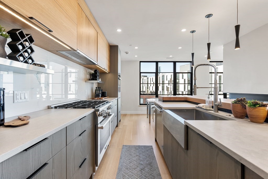 76 Wareham Street, Unit 4A Boston, MA 02118 - Photo 7 of 38 a kitchen with a sink stove and cabinets